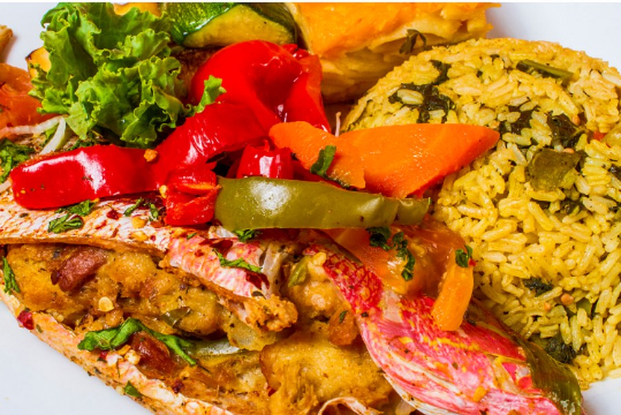 Catering plate with seafood, rice and fresh vegetables