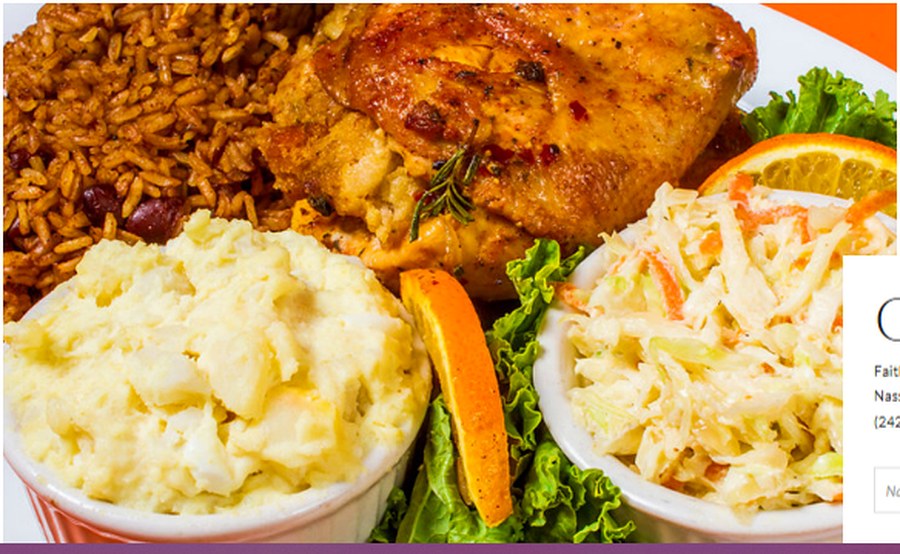 A takeaway plate of baked chicken with peas and rice